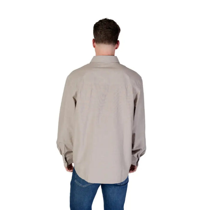 Tan long-sleeved Calvin Klein Jeans button shirt for men in beige color