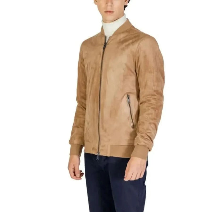 Tan suede bomber jacket with zippered pockets and ribbed cuffs by Gianni Lupo