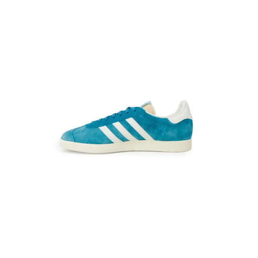 Teal Adidas Gazelle sneaker featuring white stripes and sole for men’s footwear