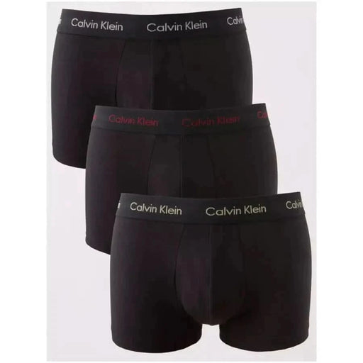 Three pairs of black Calvin Klein boxer briefs stacked vertically for men’s underwear