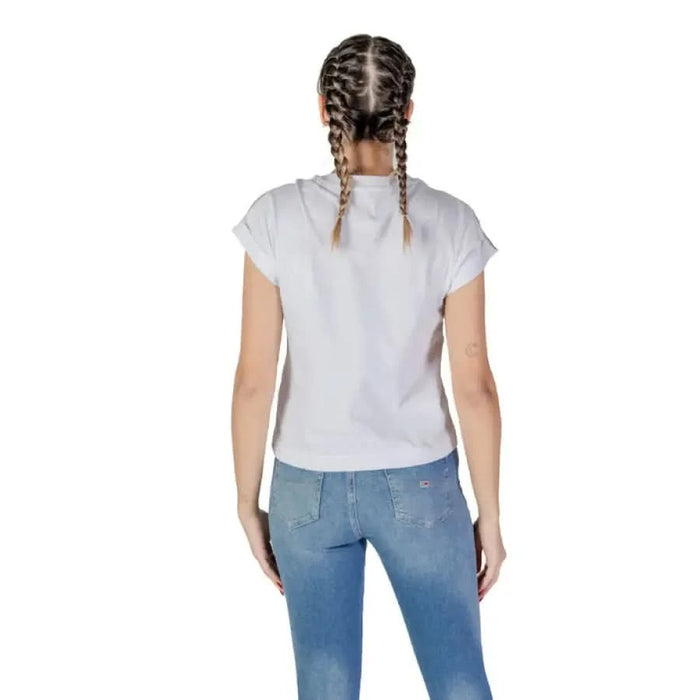 Back view of braided hair with Guess Women’s White Round Neck T-Shirt and blue jeans