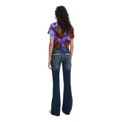 Back view of flared blue jeans with Desigual Women’s Purple Round Neck T-Shirt