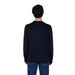 Back view of a person in a black sweater and blue jeans wearing Gas Men Cashmere Cotton Sweater