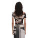 Back view of a woman with curly hair in a geometric patterned dress by Desigual