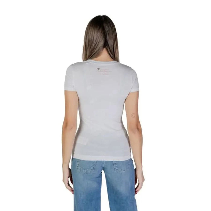 Back view of Guess Women’s White Print T-Shirt paired with blue jeans