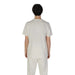 Back view of a person in white medical scrubs promoting Underclub Men T-Shirt