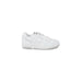 White low-top New Balance sneakers for men, showcasing stylish design and comfort