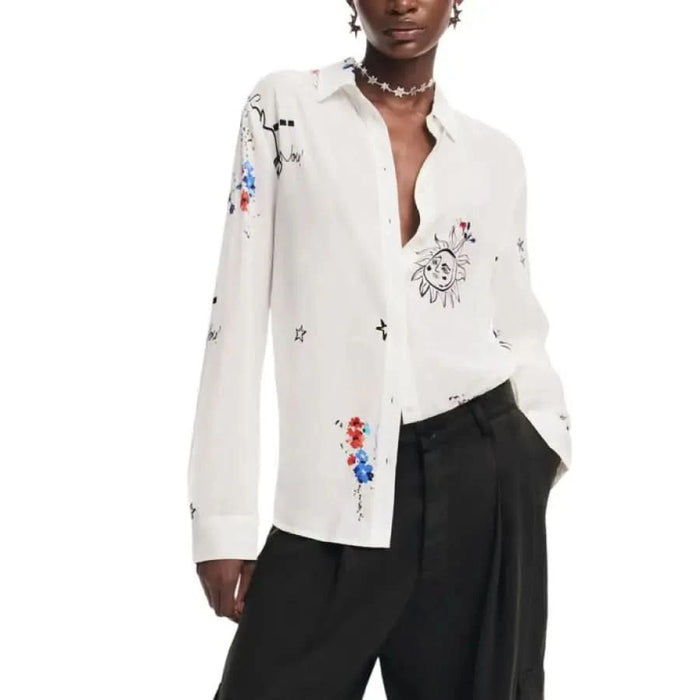 White button-up shirt featuring vibrant embroidered designs by Desigual for women