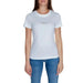 White Calvin Klein t-shirt worn by woman with blue jeans from Calvin Klein Jeans collection