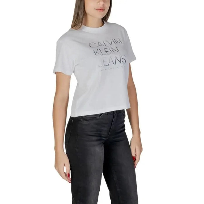 White Calvin Klein Jeans logo t-shirt with black pants, 100% cotton, stylish outfit