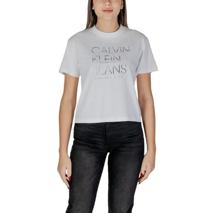 White Calvin Klein Jeans logo t-shirt with black denim pants for casual style