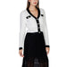 White cardigan with black trim over a black skirt from Morgan De Toi Women Knitwear