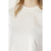 White crewneck sweatshirt featuring subtle embroidered text from Guess Active Women collection