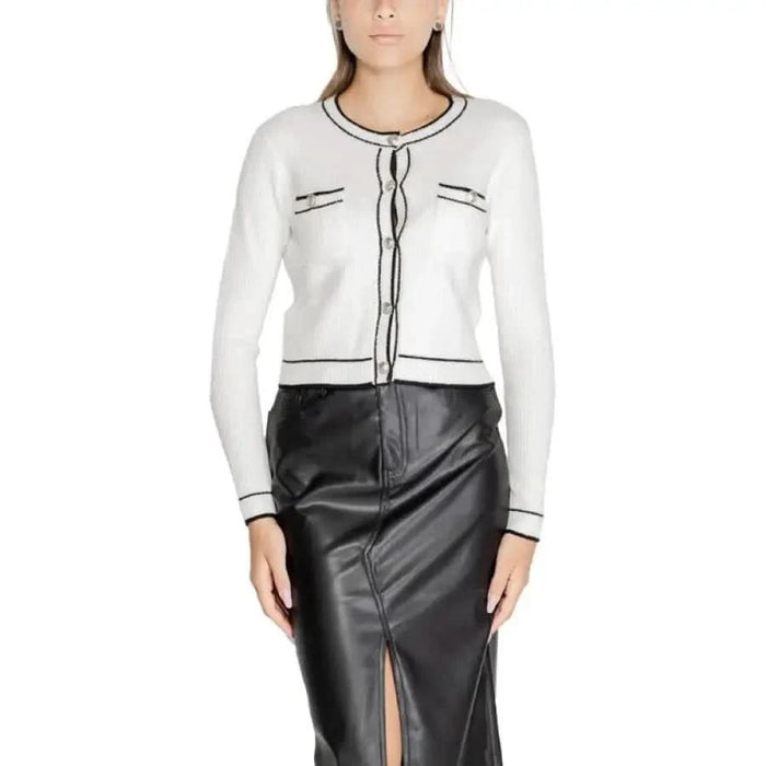 White cropped cardigan with black trim and decorative pockets by Morgan De Toi