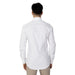 Calvin Klein Men’s white dress shirt worn by a person, viewed from behind