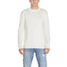 White knit sweater with logo on chest from Tommy Hilfiger Men Knitwear collection