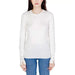 White long-sleeved crewneck sweater with blue jeans from Guess Women Knitwear collection