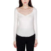 Woman wearing Guess white long-sleeved scoop neck top from the Guess Women Knitwear collection