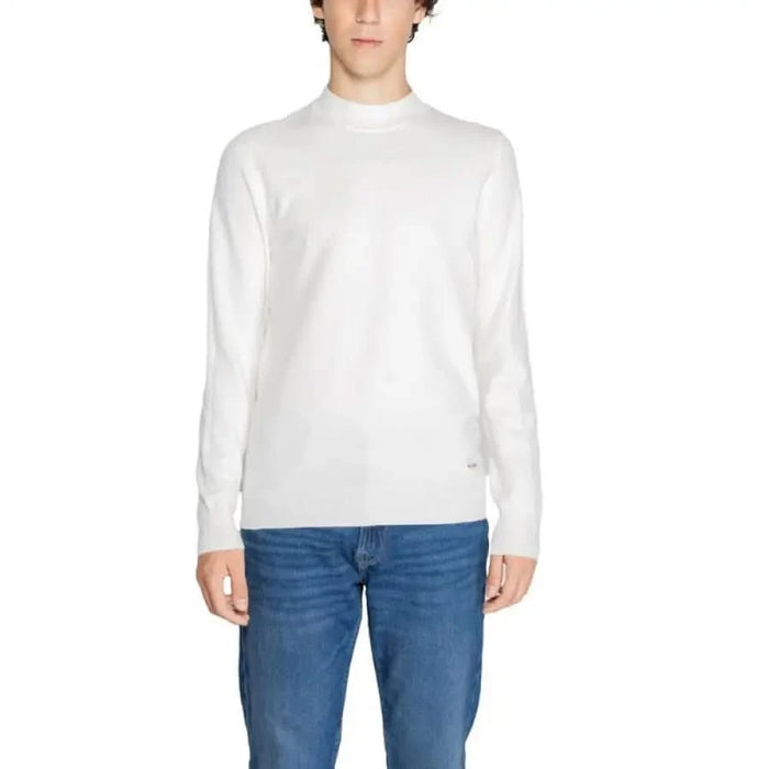 White mock turtleneck sweater paired with blue jeans in Gianni Lupo Men Knitwear