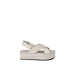 White Calvin Klein platform sandal with crossed straps and logo