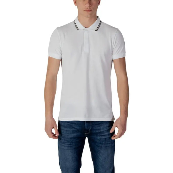 White polo shirt paired with dark blue jeans from Colmar Originals Men’s collection