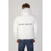 White puffer jacket featuring Klein Jeans branding on the back for men by Calvin Klein Jeans