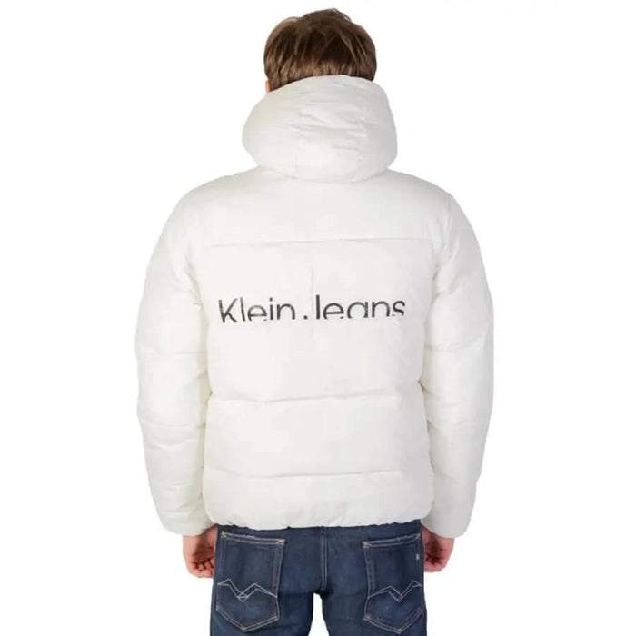 White puffy jacket featuring Calvin Klein Jeans branding on the back