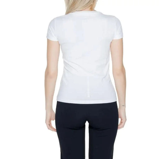 Blonde woman wearing White Ea7 Women’s T-Shirt with black pants