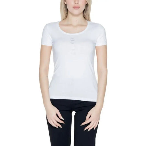 Ea7 Women T-Shirt: White short-sleeved top worn by woman with black pants