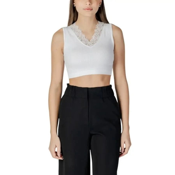 White sleeveless crop top with lace trim at v-neckline from Guess Women’s collection