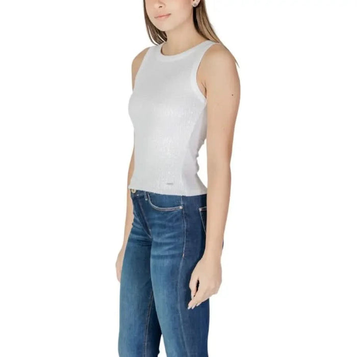 White Paillette Tank Top by Guess styled with blue jeans for a chic look