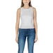 White sleeveless ribbed tank top with blue jeans from Guess Women’s collection