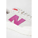 White New Balance Women Sneakers with pink ’N’ logo on the side