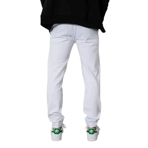 Armani Exchange Men Trousers - White sweatpants with green and white sneakers visible