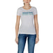 White t-shirt featuring gradient blue GUESS logo print for women’s fashion