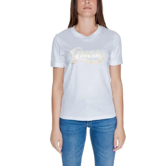 Guess Women’s White T-Shirt with Gold Logo worn by a person in blue jeans