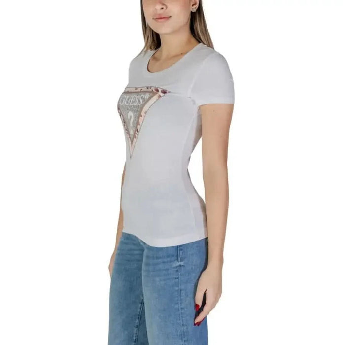 White Guess Women’s T-Shirt featuring a metallic triangle logo design on the front