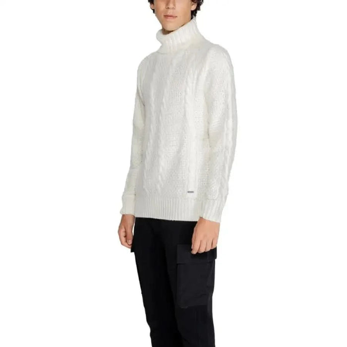 White turtleneck sweater on a person with dark curly hair from Gianni Lupo Men Knitwear