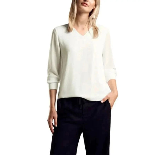 White V-neck sweater with long sleeves worn by model, featured in Street One Women Blouse