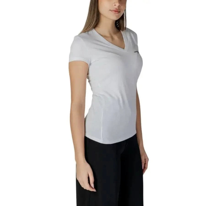 White Armani Exchange Women’s V-Neck T-Shirt paired with stylish black pants