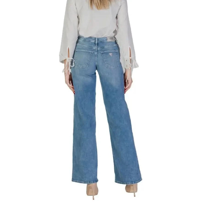 Wide-leg blue denim jeans with light wash featured in Guess Women’s Trousers with Pockets