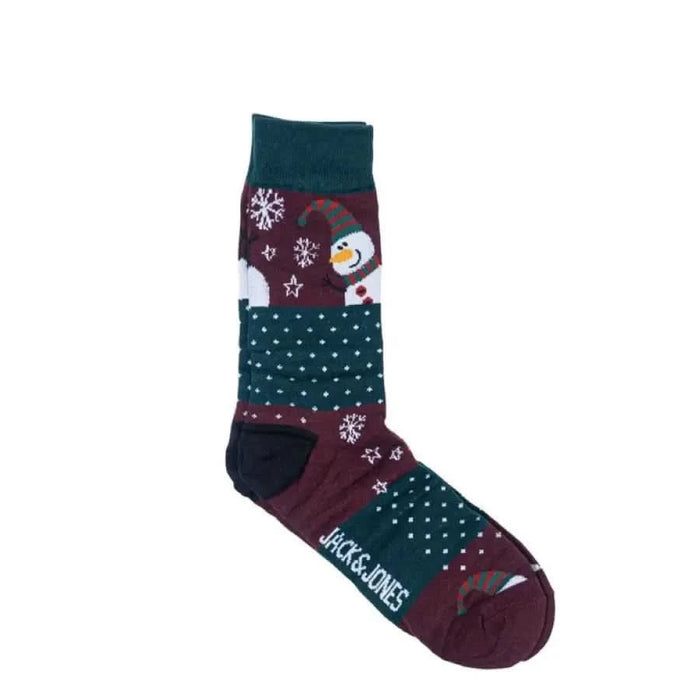 Winter-themed sock with penguin and snowflake patterns in green, burgundy, and white