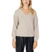 Woman in beige sweater, black pants for fall winter product - Jacqueline De Yong Knitwear