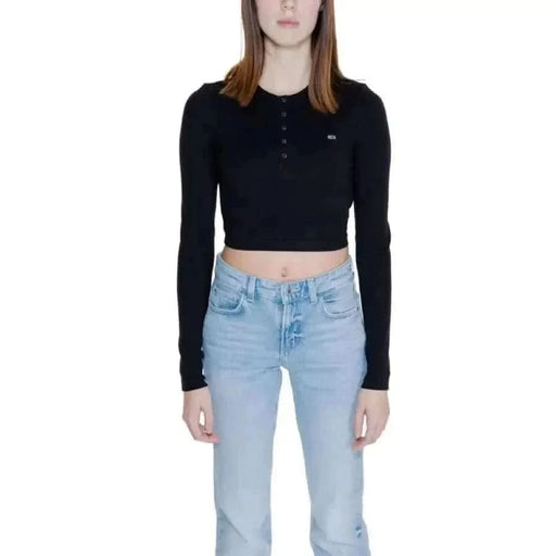 Woman in black cropped long-sleeve top and light blue jeans - Tommy Hilfiger Women T-Shirt