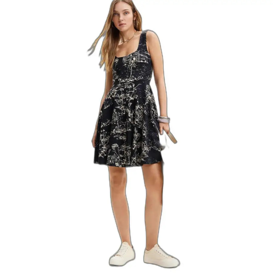 
                      
                        Woman in black dress with white and gold pattern - Desigual - Urban Style Clothing
                      
                    