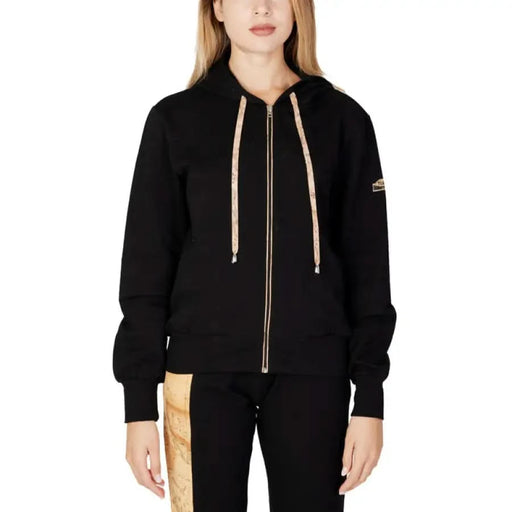 Alviero Martini Prima Classe woman in black hoodie with gold zipper