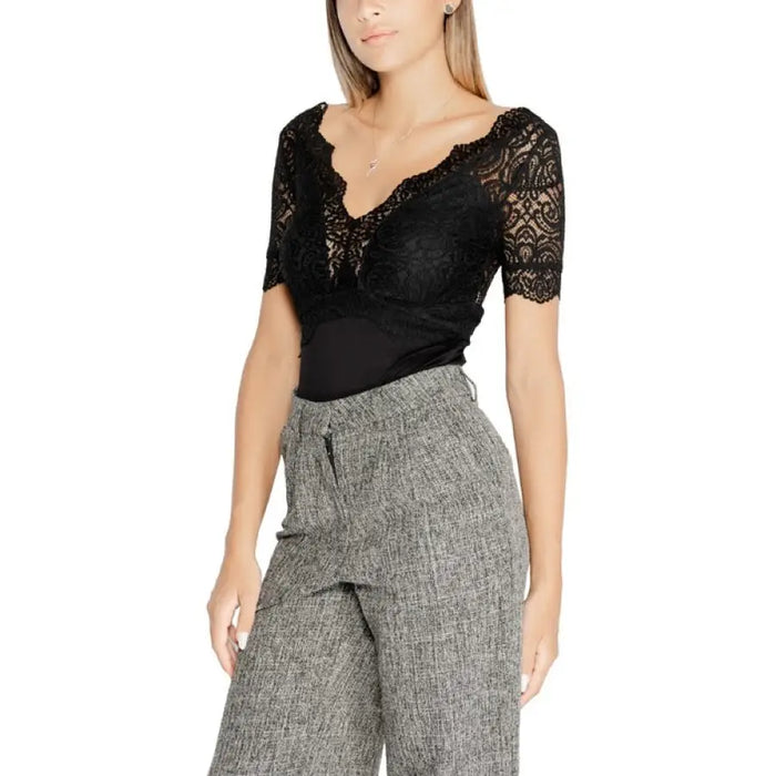 Woman in black lace top and gray wide-leg pants from Morgan De Toi Women T-Shirt