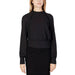 Woman in Sandro Ferrone black top and skirt, Sandro Ferrone Women Blouse feature