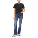 Woman in black t-shirt, blue jeans, and sneakers - Tommy Hilfiger Women T-Shirt