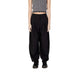 Woman in Aware Aware Women black and white top with Aware Women Trousers